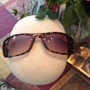 Two tortoise colored, amber lens sunglasses new without tags. One Ray ban logo.